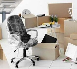 Office chair with card board moving boxes